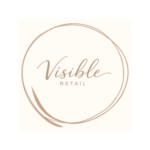 Logo for Visible Retail i beige og brun med håndskrevet typografi og cirkelformet design
